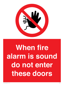 When fire alarm is sound do not enter these doors Prohibition Sign