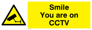 Smile you are on CCTV sign 