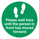 please-wait-here-until-the-person-in-front-has-moved-forward--green~