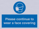 please-continue-to-wear-a-face-covering~