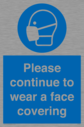 please-continue-to-wear-a-face-covering~