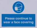 please-continue-to-wear-a-face-covering~