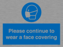 please-continue-to-wear-a-face-covering~