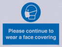 please-continue-to-wear-a-face-covering~