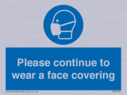 please-continue-to-wear-a-face-covering~