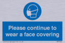 please-continue-to-wear-a-face-covering~