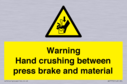 warning-hand-crushing-between-press-brake-and-material~