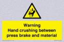 warning-hand-crushing-between-press-brake-and-material~