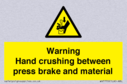 warning-hand-crushing-between-press-brake-and-material~