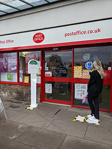 Freestanding QControl managing the queue outside a post office counter