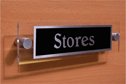 stores--door-sign-with-belwe-medium-negative-black-text~